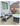 Tru 180 Round Fire Table in Light Gray Finish with Matching Adirondack Chairs Outdoors