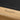 Legacy Billiards Forge Pool Table in Honey Ash Finish with Black Cloth - Room Shot - Logo Rail Closeup